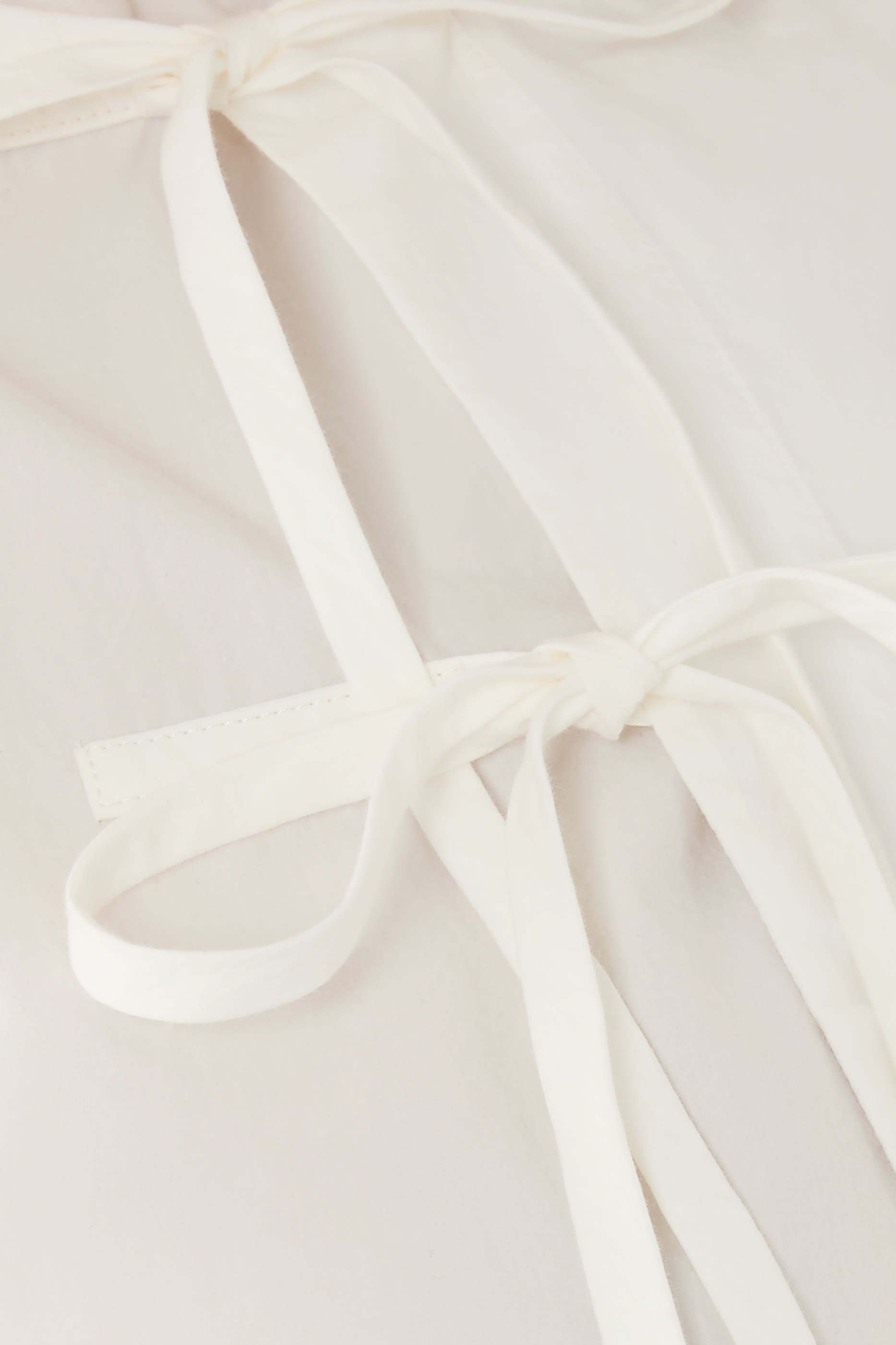 بلوزة كيوتو بربطة في الأمام