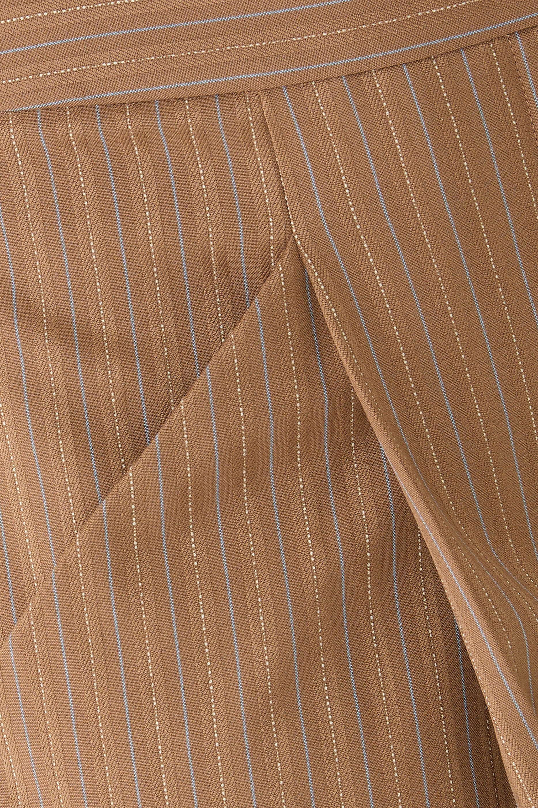 بنطال ريميني بقصة ساق واسعة