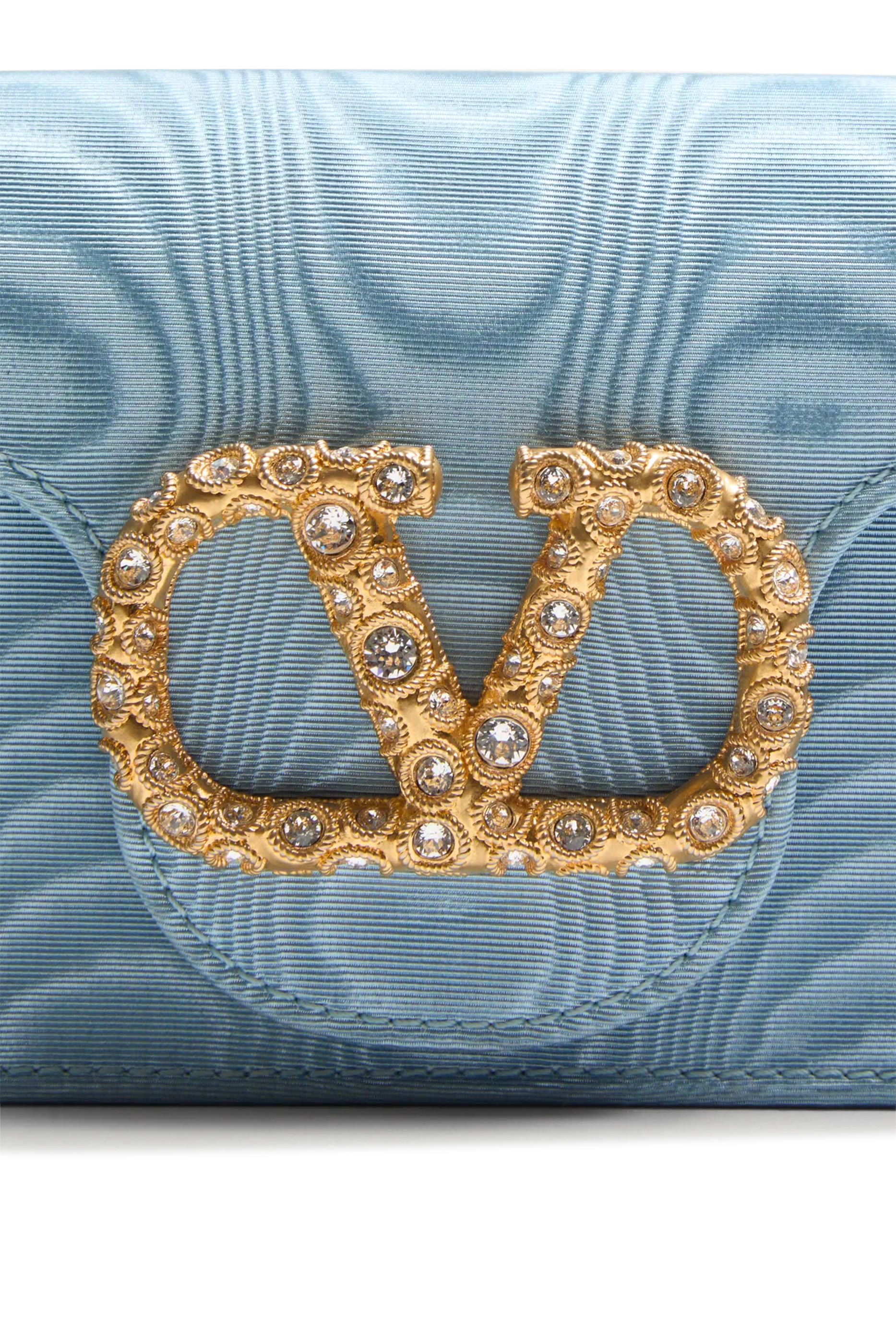 حقيبة كلاتش لوكو بحلية شعار الماركة بأحجار