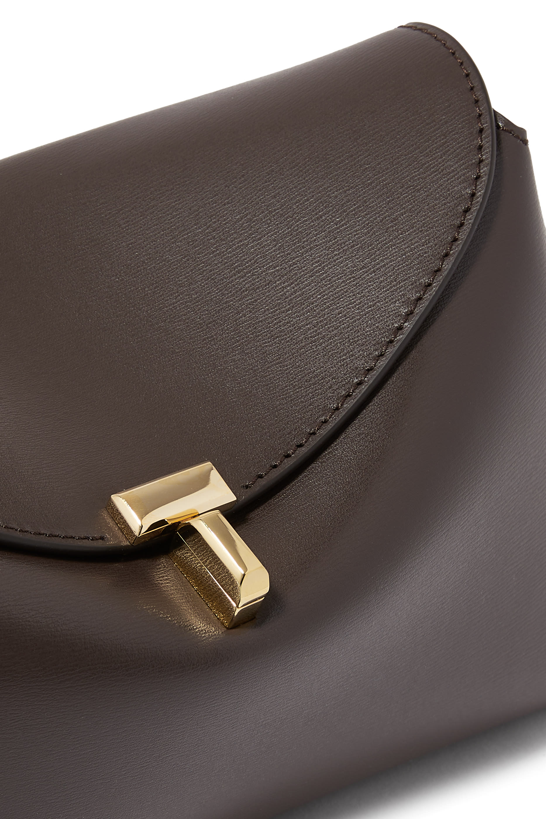 حقيبة كلاتش بقفل على شكل حرف T جلد