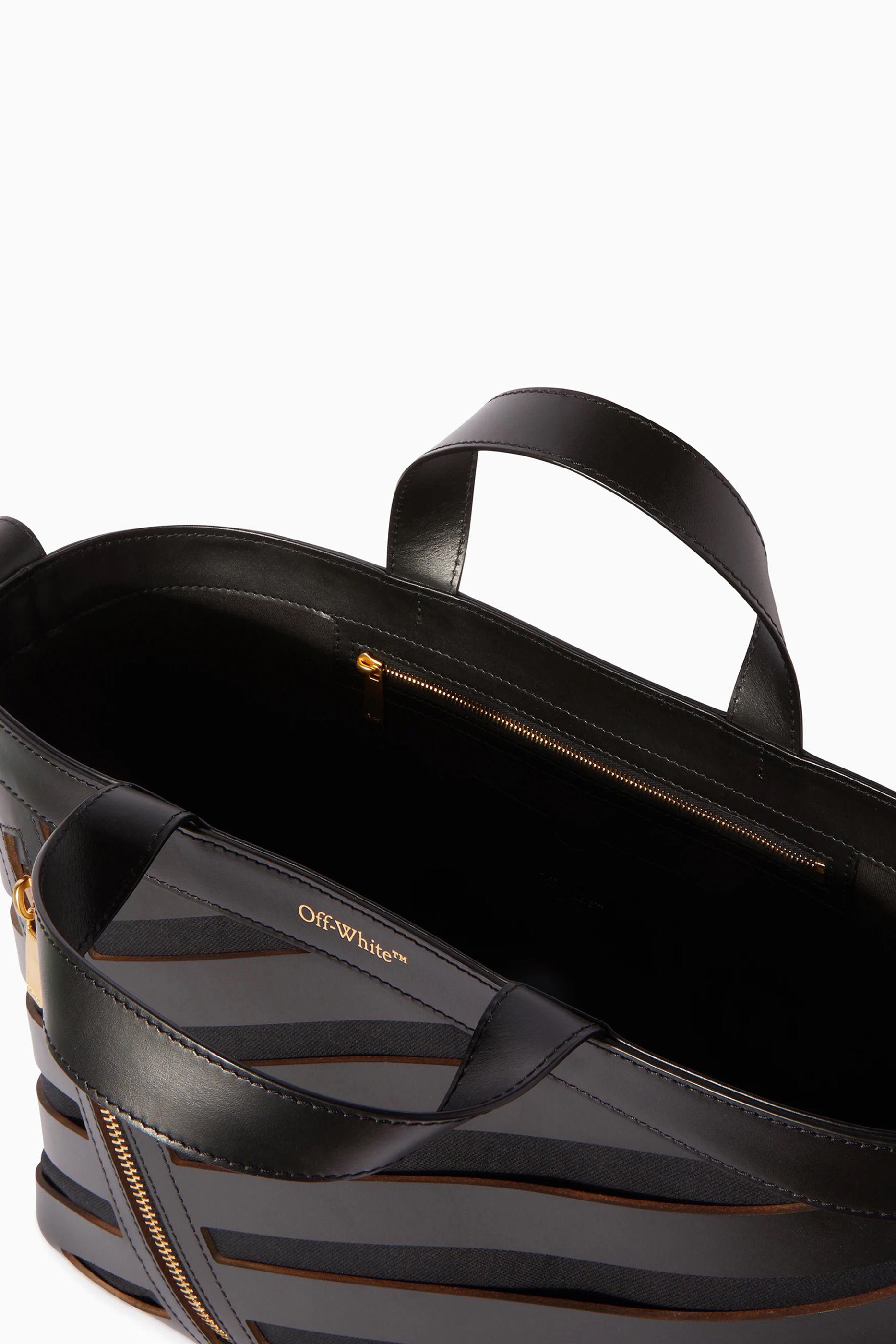 حقيبة يد صغيرة بفتحات مائلة