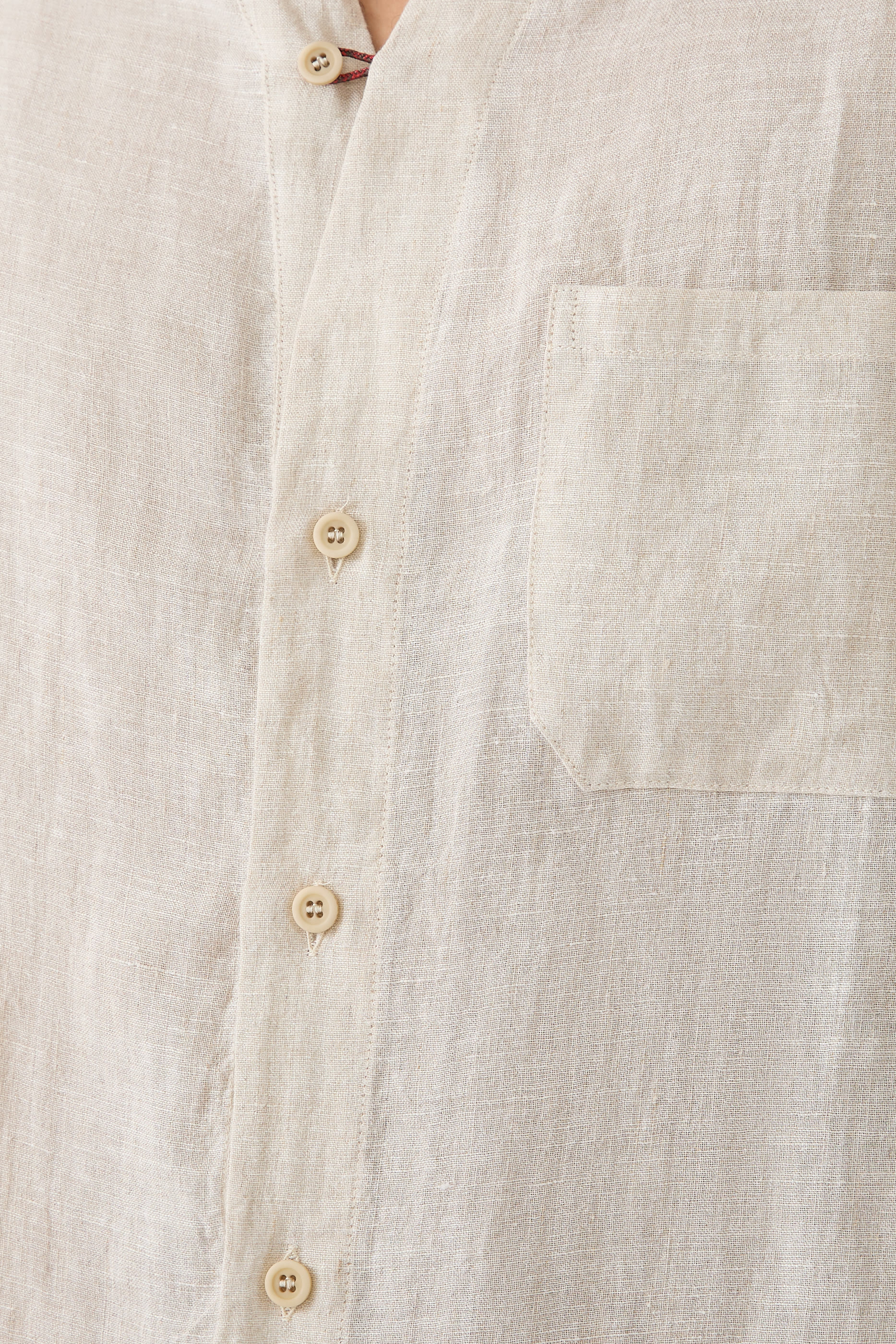 قميص بحافة مقوسة