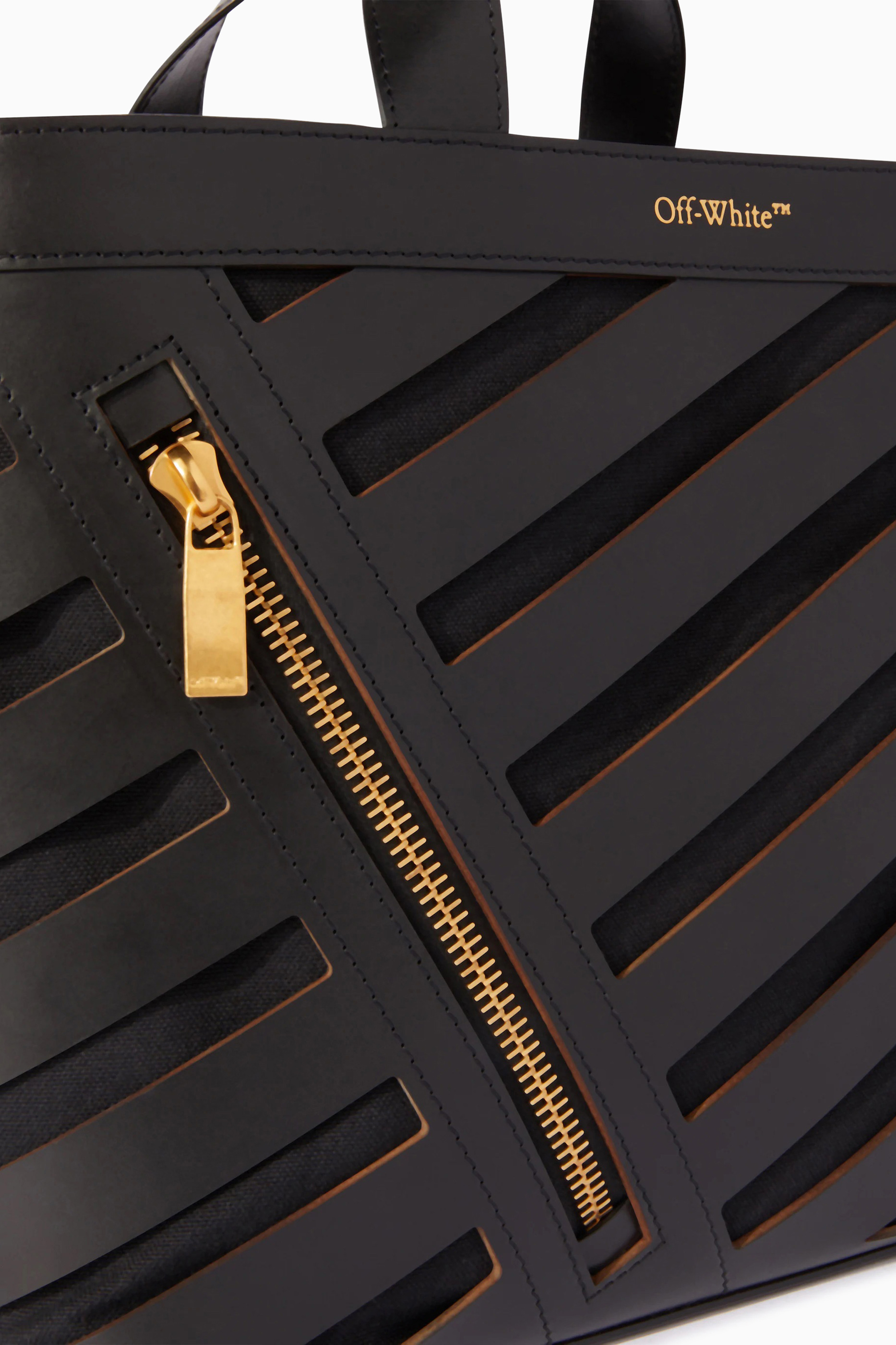 حقيبة يد صغيرة بفتحات مائلة