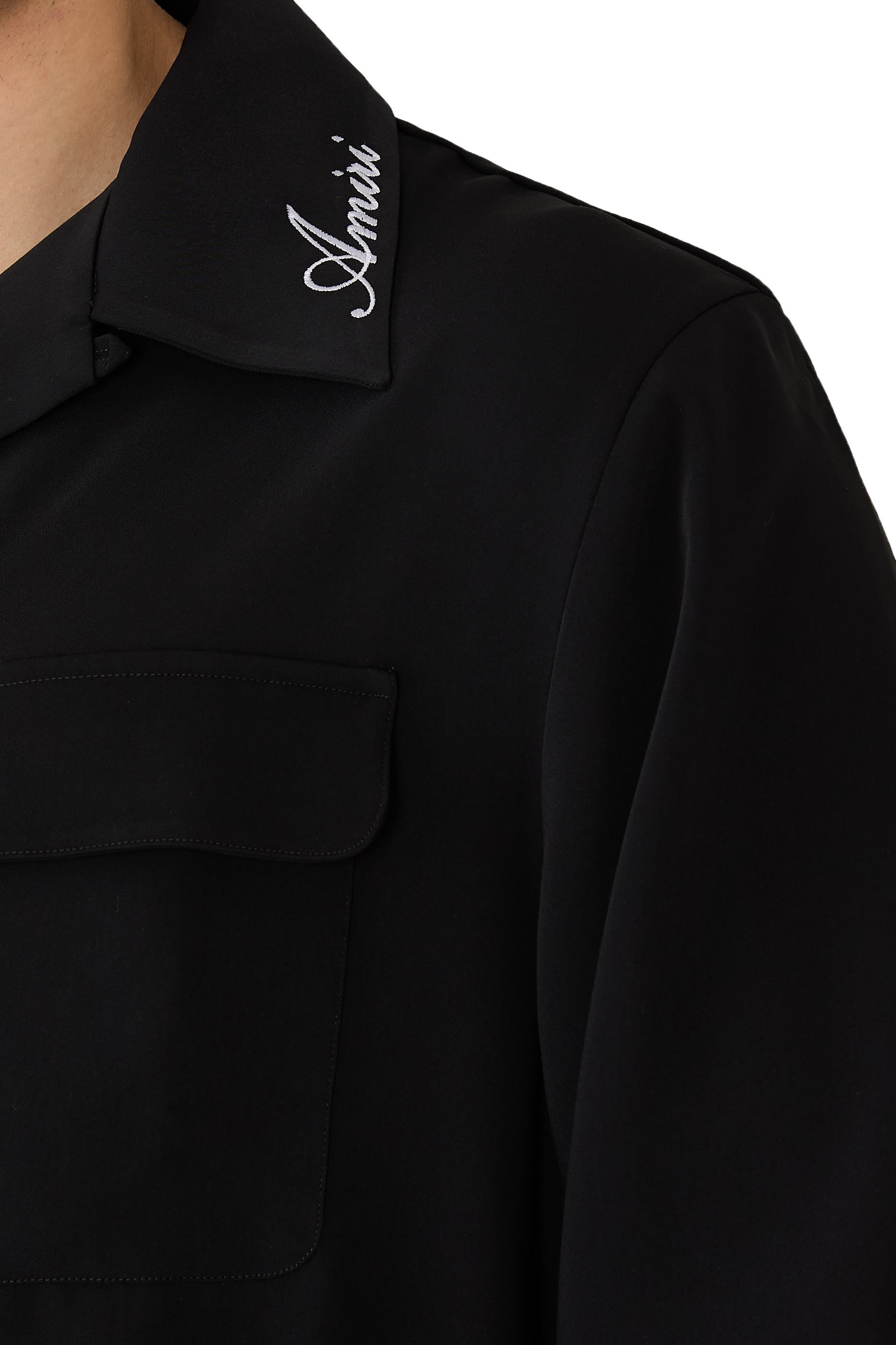 قميص بجيوب بحواف دائرية