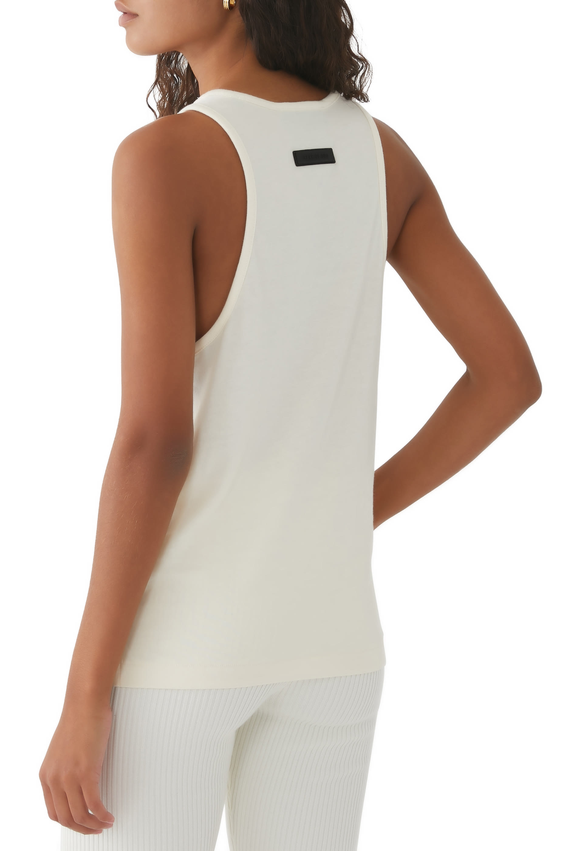 تيشيرت بلا أكمام بشعار اسنشالز