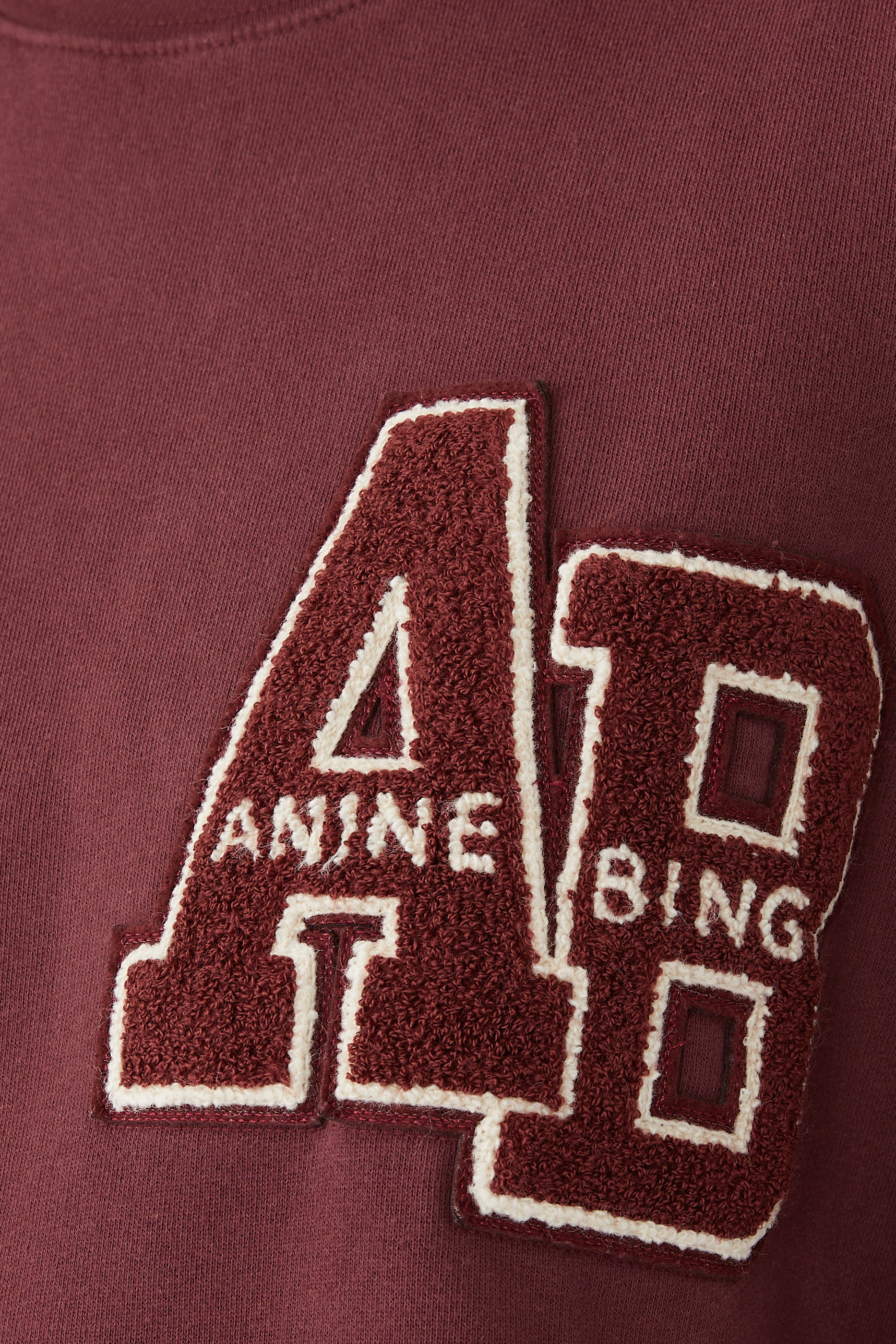 سويت شيرت مايلز بقصة فضفاضة وحروف شعار الماركة