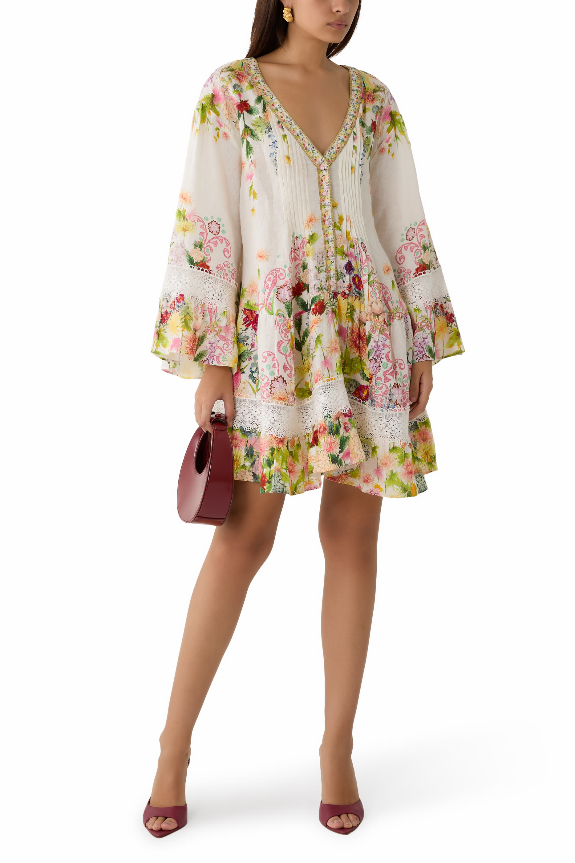 فستان كول اوف كاتالونيا بطيات وياقة على شكل حرف V