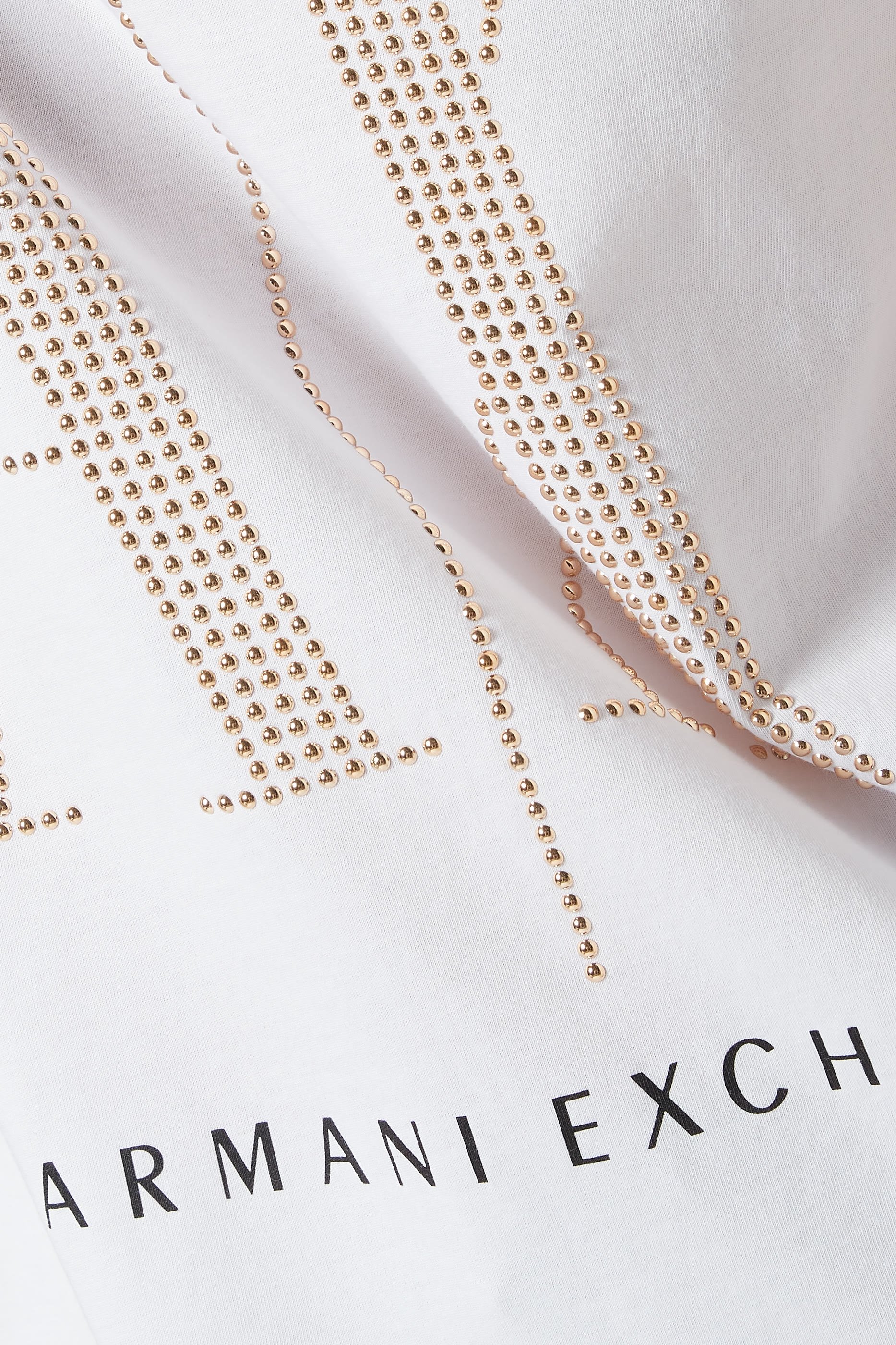 تي شيرت أيكون بحلي معدنية على شكل شعار الماركة