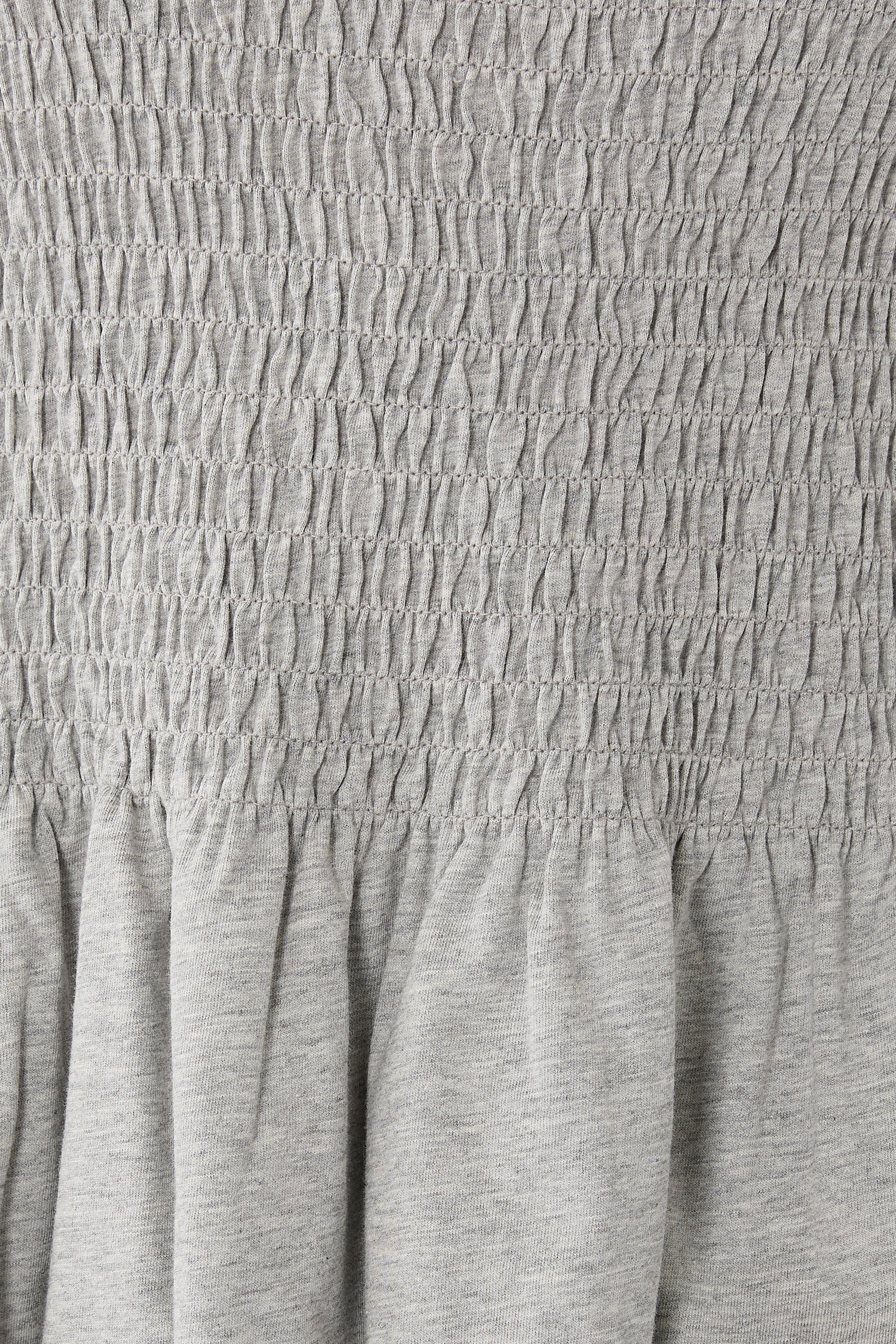 بلوزة بحافة جرس بكشكش