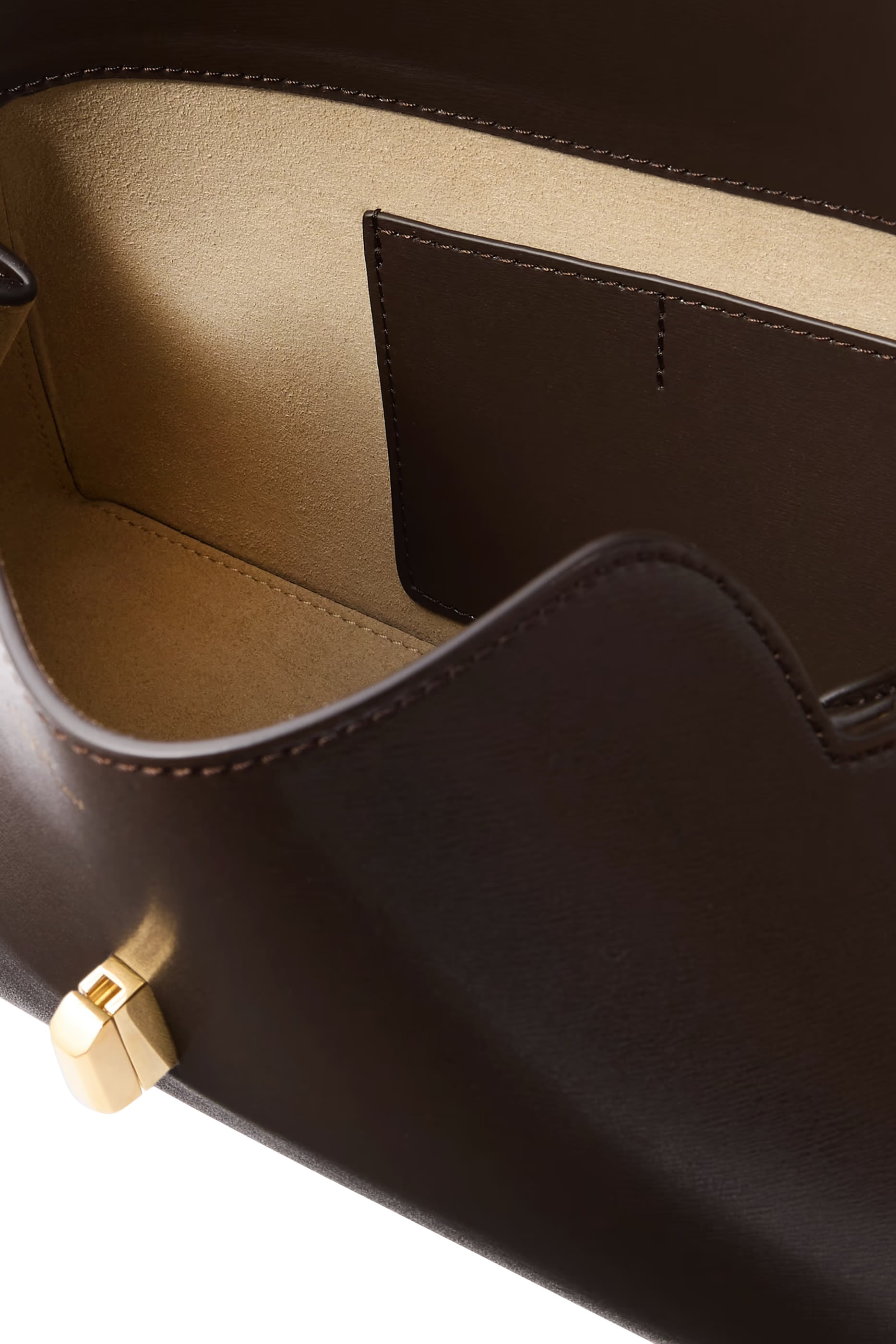 حقيبة كلاتش بقفل على شكل حرف T جلد