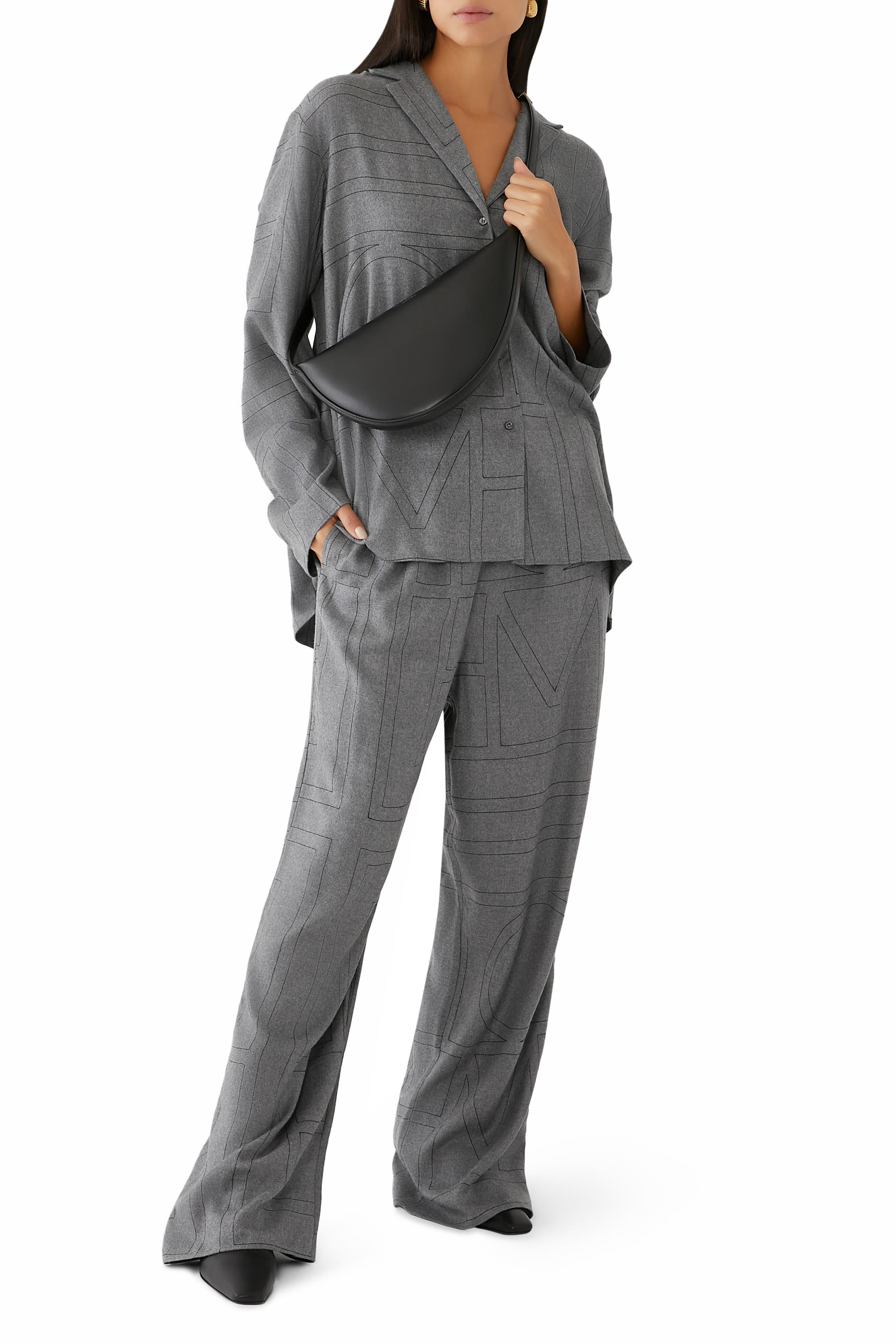 حقيبة سلينغ بتصميم مقوس جلد