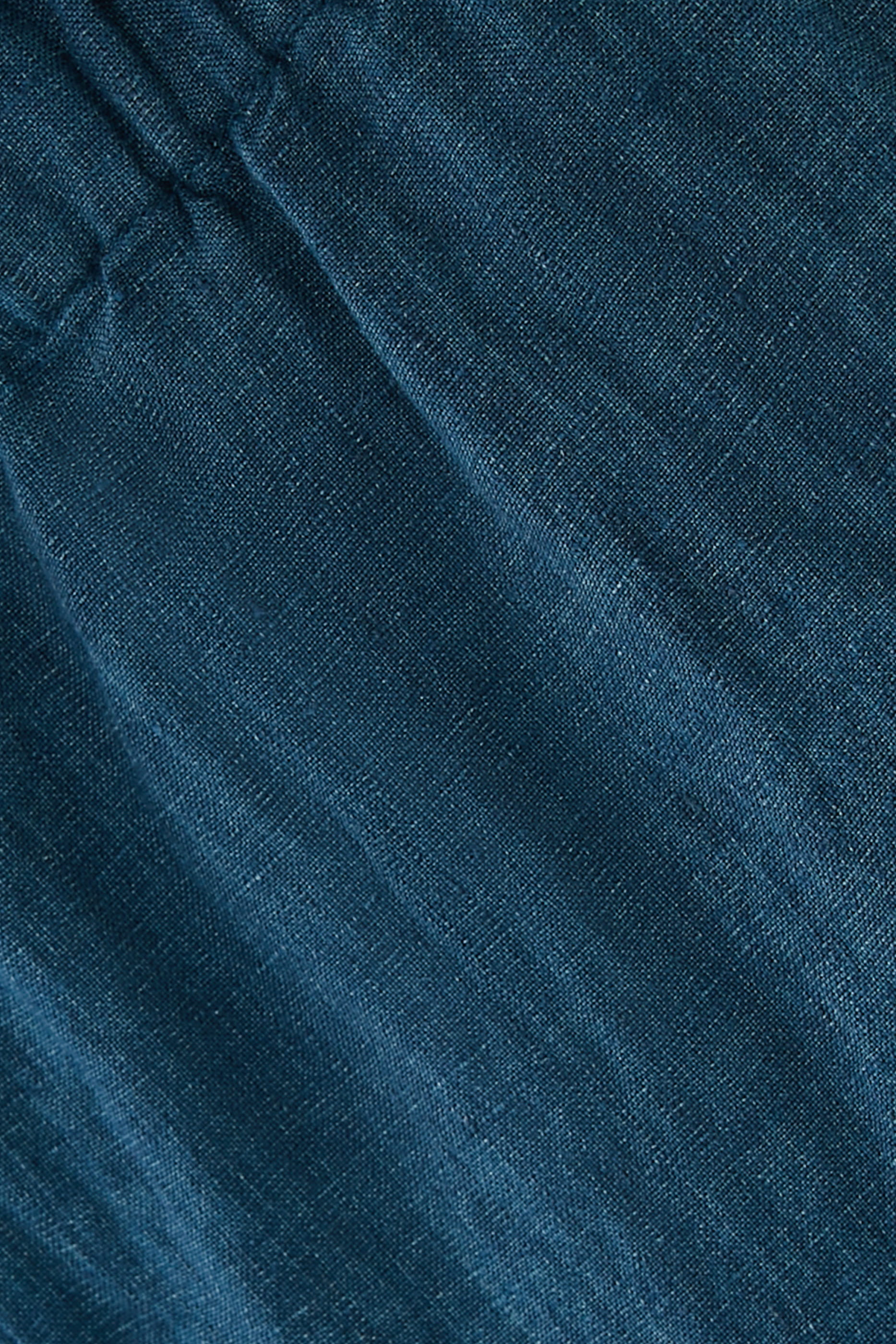 بنطال بقصة ساق واسعة ولون باهت كتان عضوي