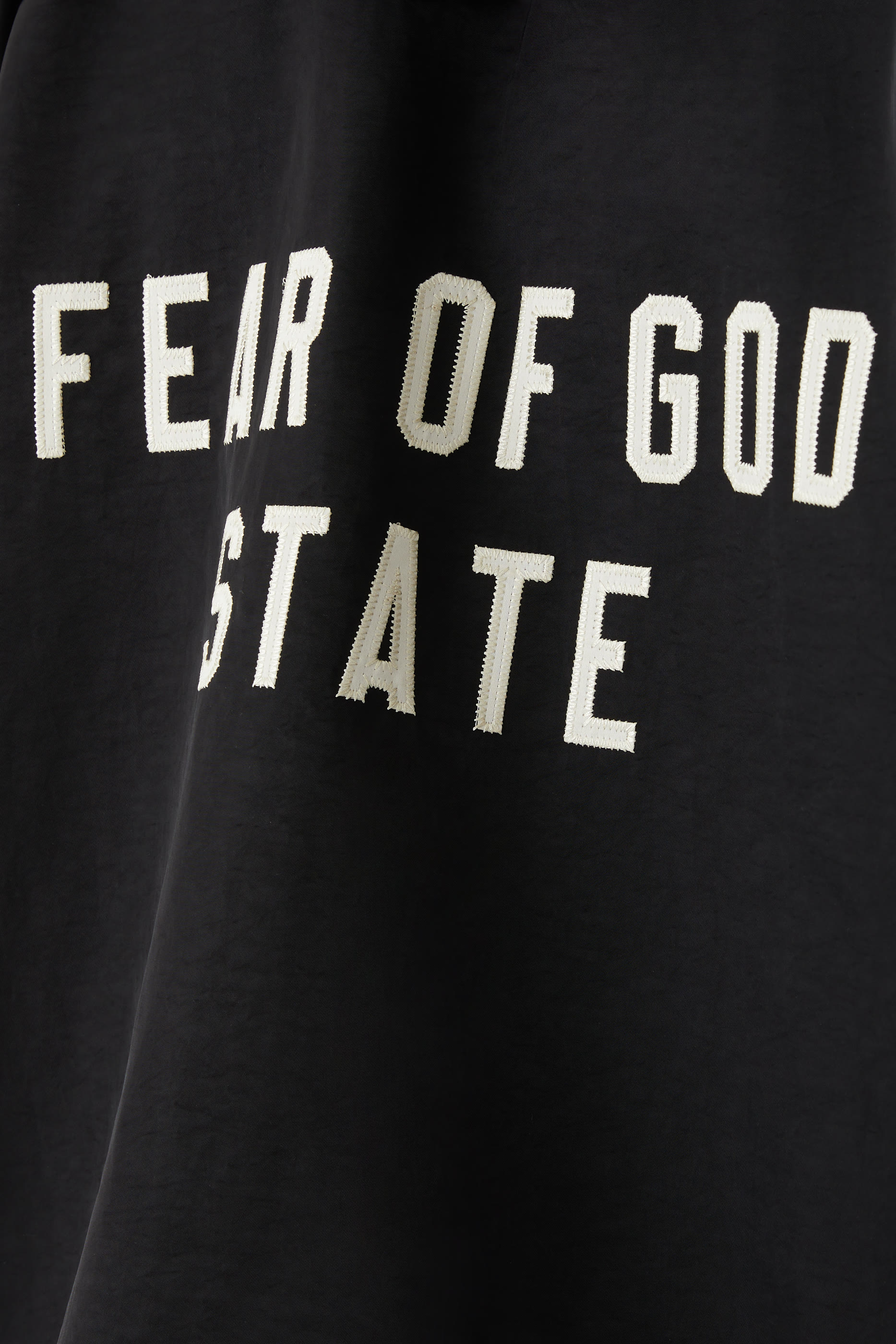 جاكيت كوتشز بغطاء رأس نايلون بارز الملمس