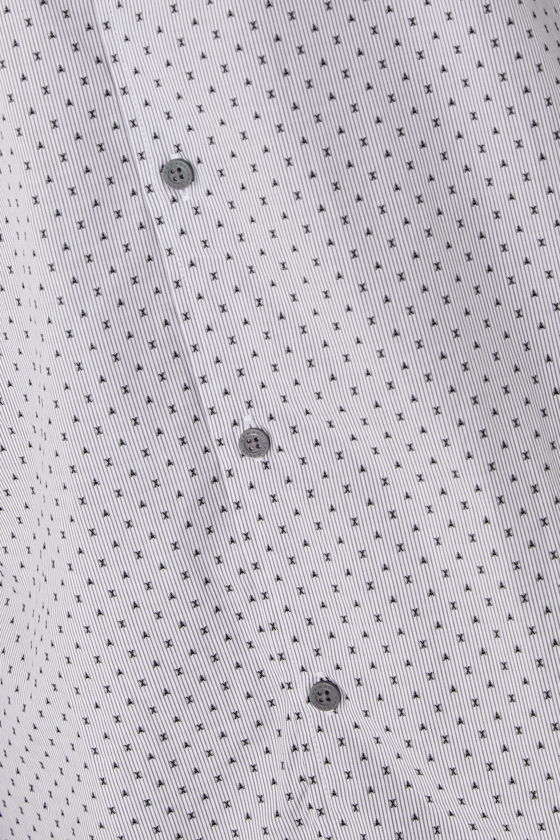 قميص منقط بأكمام طويلة مزين بشعار الماركة